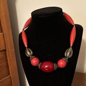 Necklace with red, silver stations